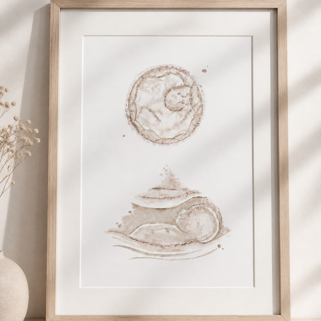 Framed artwork of watercolour embryo and ultrasound painting on a light background