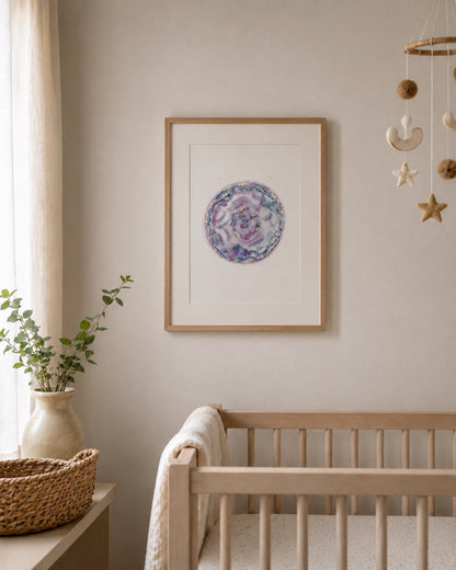 Nursery room with a framed watercolour embryo, crib, and decorative items.