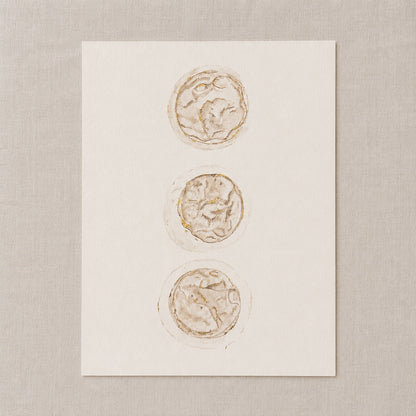 Watercolour painting of 3 embryos on a white card against a beige background