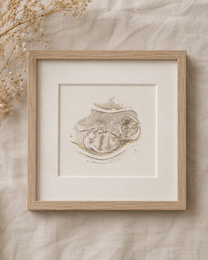 Framed artwork of an ultrasound/sonogram watercolour painting on a beige textured background